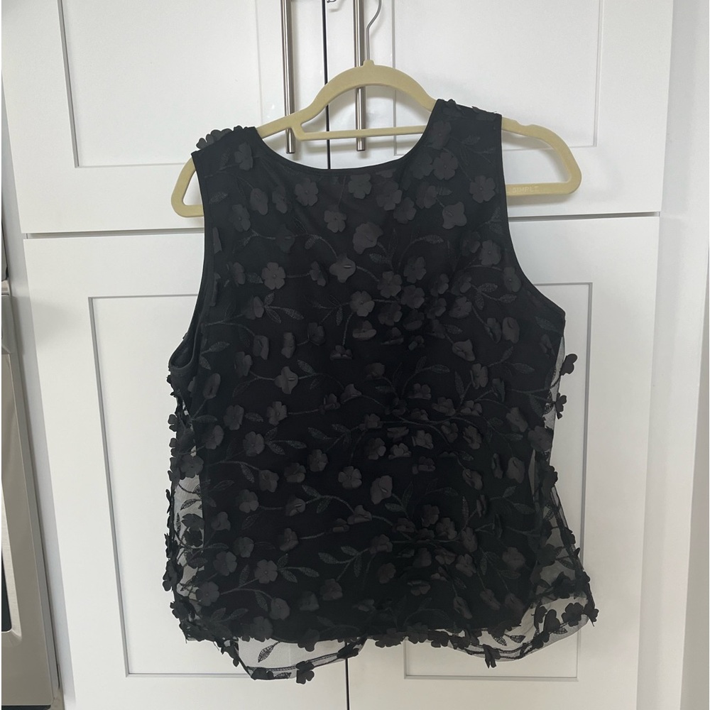 Beautiful ladies black blouse with “petals”